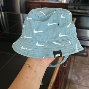 Nike Teal Bucket Hat with White Swoosh Pattern